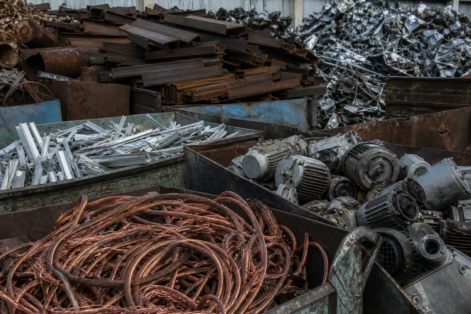 Sorted industrial scrap including steel, motors, and cable
